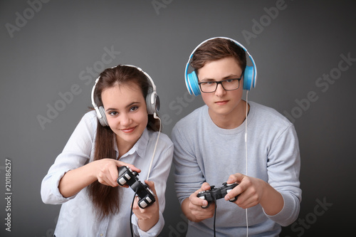 Teenagers with gamepads on ...