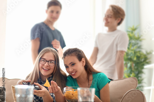 Teenagers playing video gam...