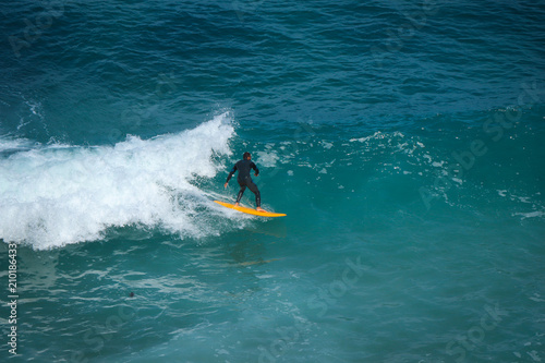 Aerial view of a surfer on a wave