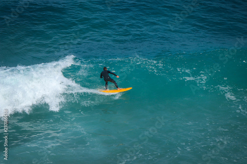 Aerial view of a surfer on a wave