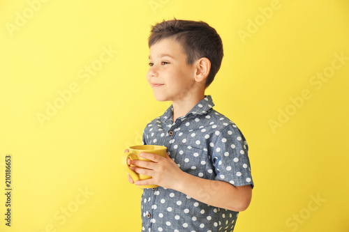 Cute little boy with cup of...