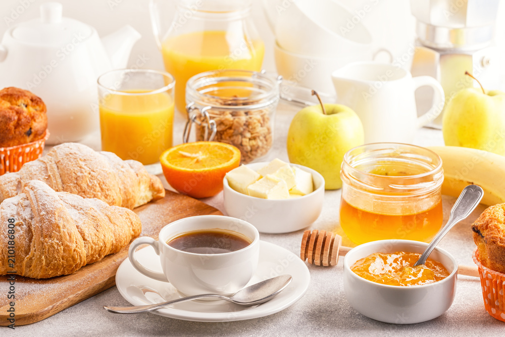 Continental breakfast with fresh croissants, orange juice and coffee Continental breakfast with fresh croissants, orange juice and coffee