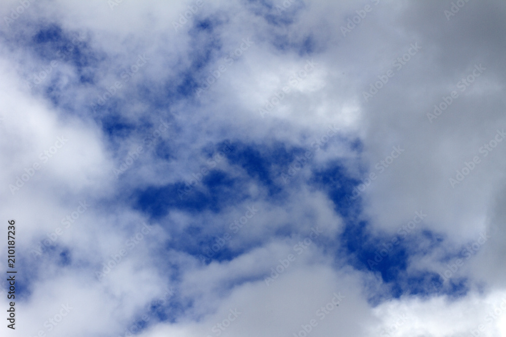 Sky clouds background. Cumulus white clouds in the dark blue sky in the morning Sky clouds background. Cumulus white clouds in the dark blue sky in the morning