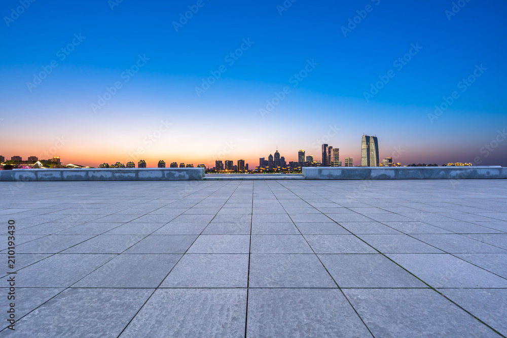 empty square with panoramic city skyline