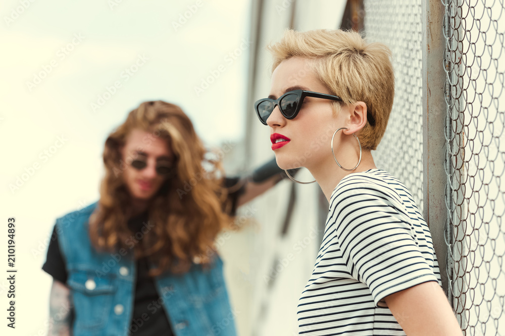 stylish girlfriend in sunglasses looking away on street stylish girlfriend in sunglasses looking away on street