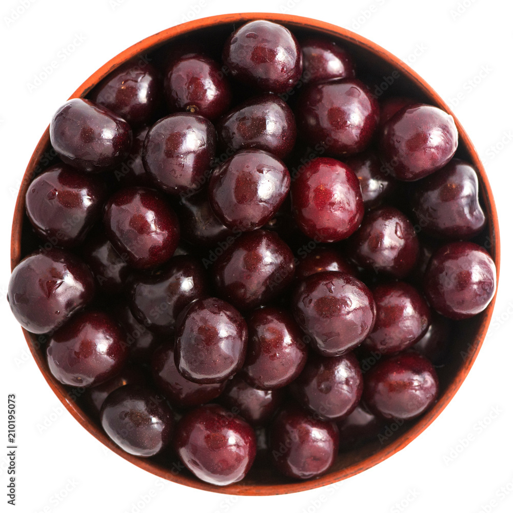 Fresh cherry in a bowl isolated on white background. Top view Fresh cherry in a bowl isolated on white background. Top view
