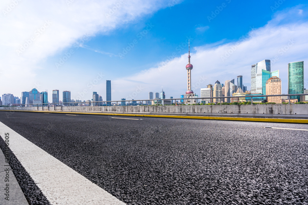 asphalt road with modern office building in urban asphalt road with modern office building in urban