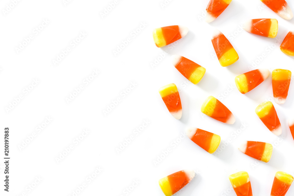 Typical halloween candy corn isolated on white background. Copyspace - obrazy, fototapety, plakaty 