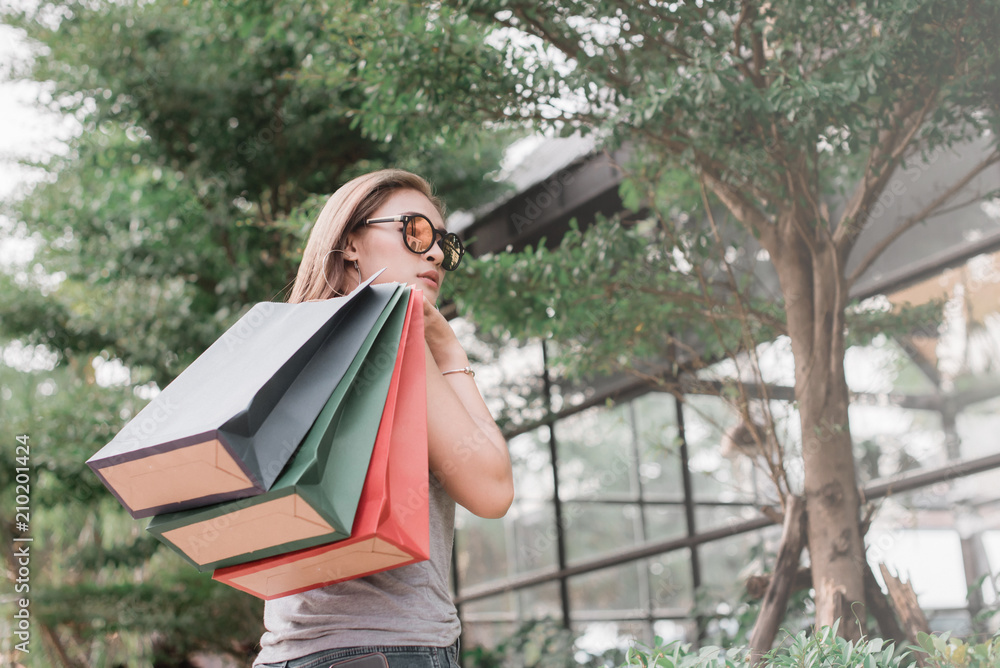 Woman in shopping. Happy woman with shopping bags enjoying in shopping. shopping lifestyle concept Woman in shopping. Happy woman with shopping bags enjoying in shopping. shopping lifestyle concept