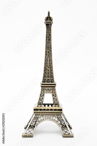 miniature model of a golden Eiffel tower on a white background (mock-up)