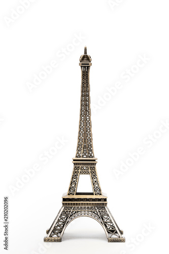 miniature model of a golden Eiffel tower on a white background (mock-up) © sabir