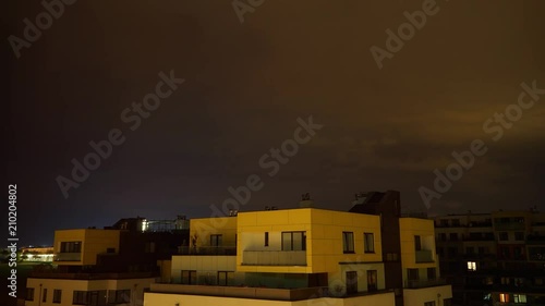 Timelapse of heavy lightning storm rolling over apartment buildings in Prague, Czech Republic