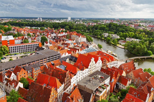 Urban landscape. View from top of German city of Lubeck. Beautiful view from high tower on roofs of city in Germany. June 2017. photo