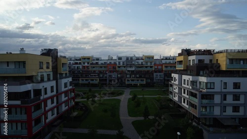 Timelapse of light clouds rolling over residential apartment complex