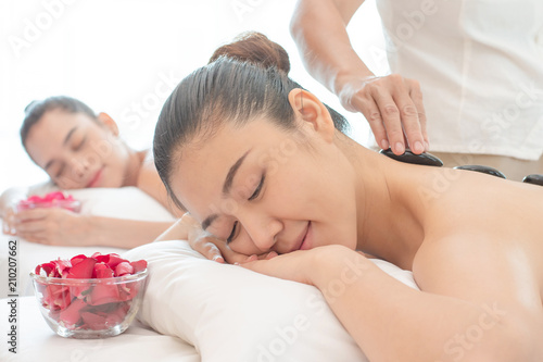 Wallpaper Mural Young Asian woman relaxing in the Spa Stone Massage. Torontodigital.ca