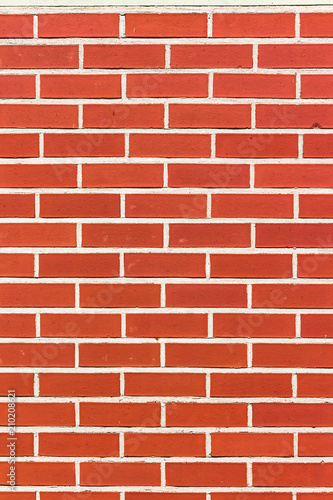 Bright Red Brick Wall in Vertical Format