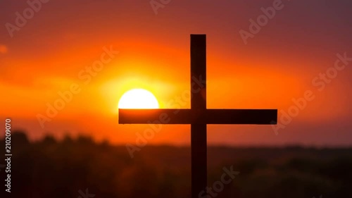 4k.Time-Lapse,Sun, orange sky in sunset, Christian Cross. photo