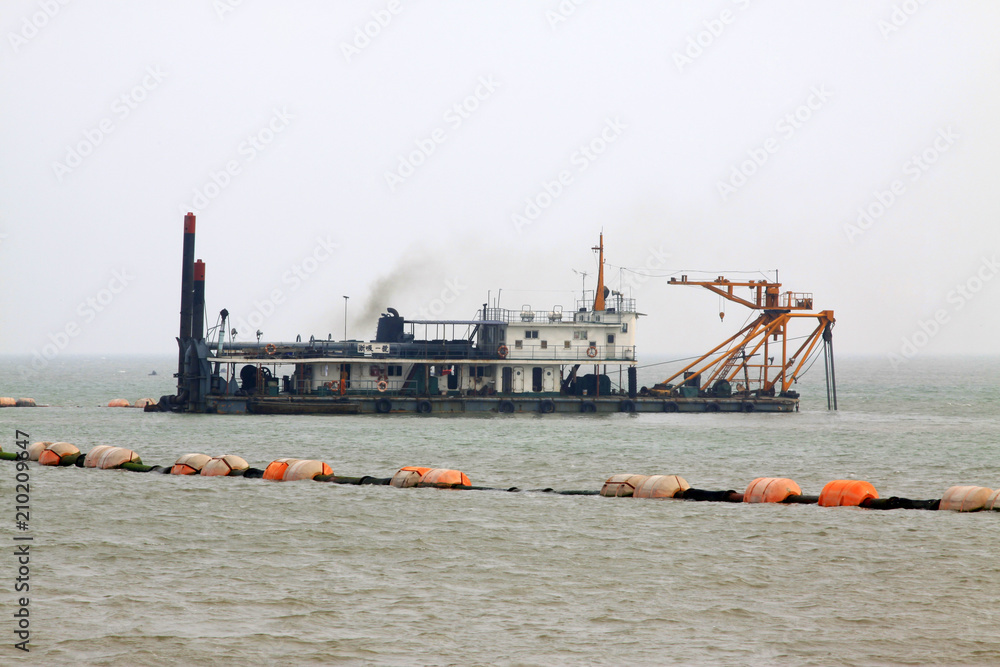 Suction sand shipping in the sea Suction sand shipping in the sea