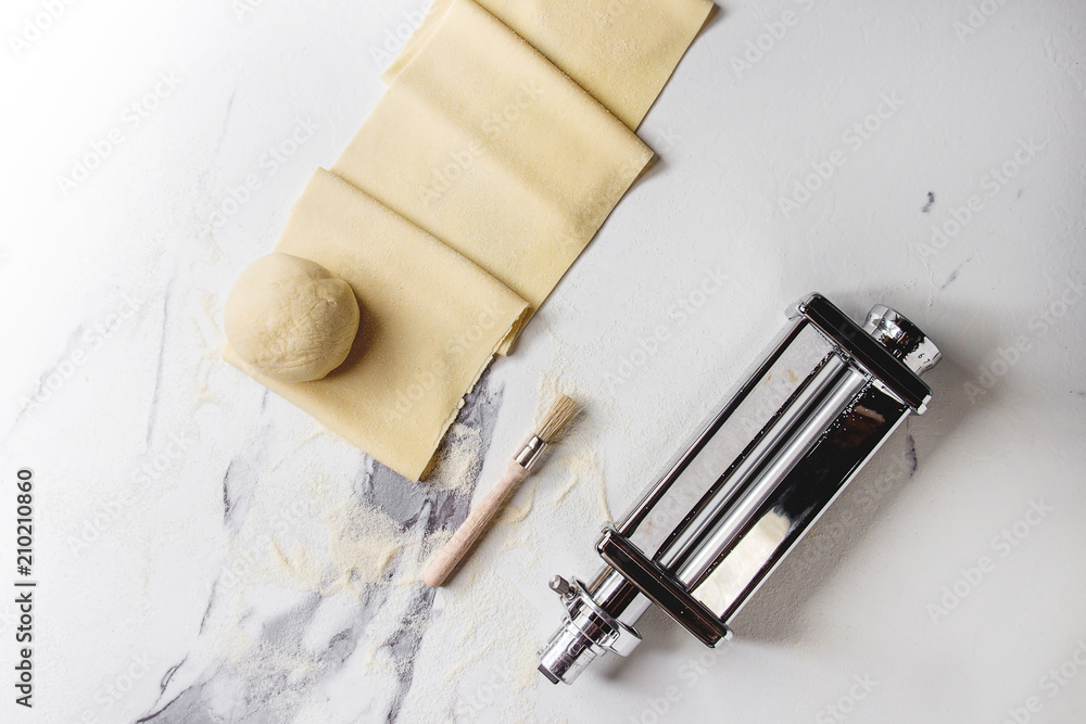 Rolled dough for homemade italian uncooked pasta lasagna from pasta machine maker with semolina
