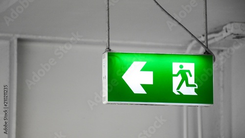 green fire exit sign in the building