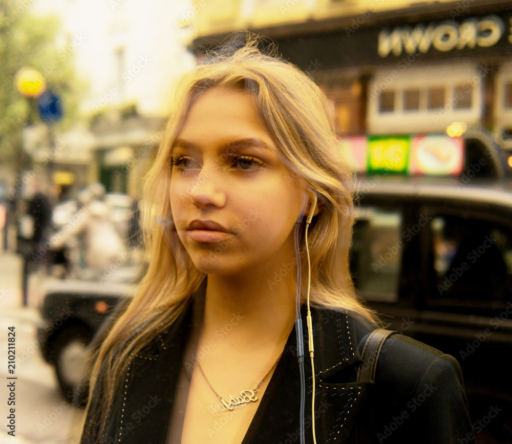 Reflection on a teenage girl in a window with head phones in Stock-Foto ...