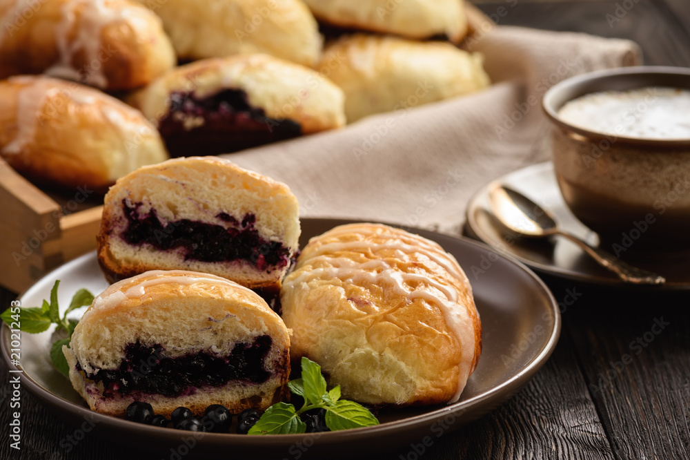 Homemade sweet buns with wild blueberry filling.