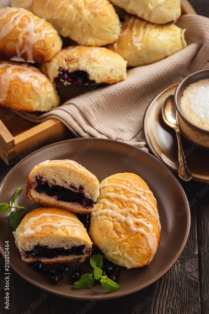 Homemade sweet buns with wild blueberry filling.