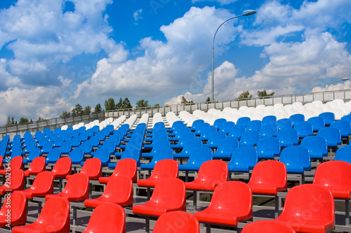Plastic seats on stadium in summer