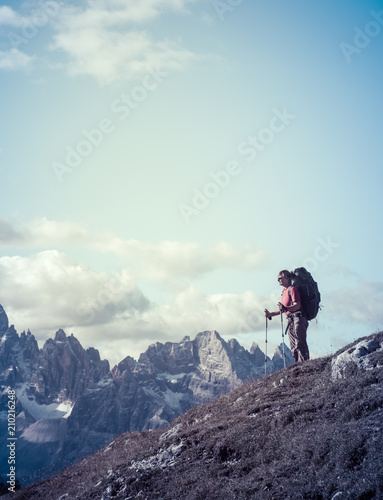 hiker in front of Alps mountains © Kotangens