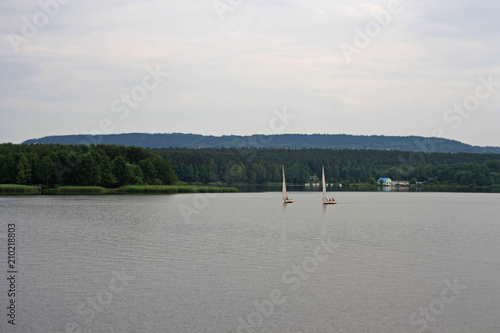 Sailboats on the lake on the background of mountains