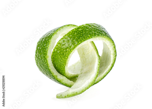 Peel of lime over white background, closeup