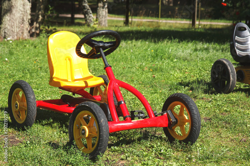 children pedal car awaiting riders at children park 