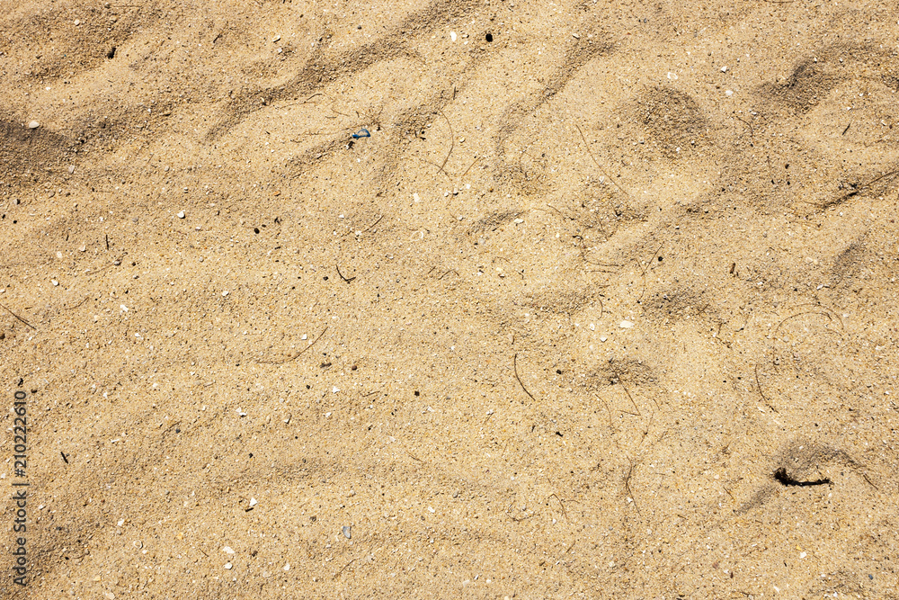 closeup of sand pattern of a beach in the summer closeup of sand pattern of a beach in the summer