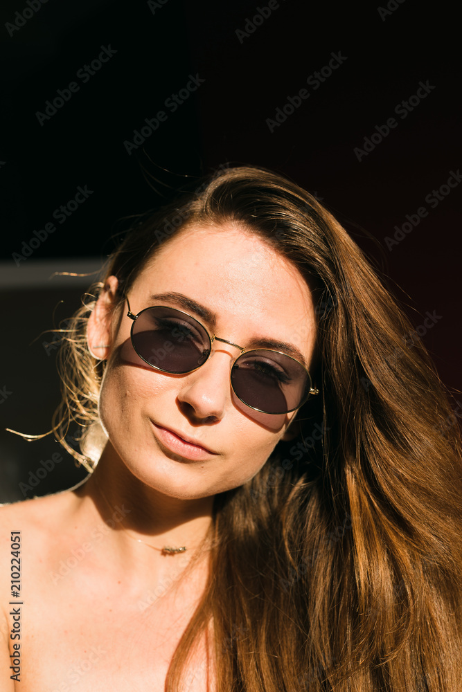 Portraits of beautiful brunette girl in sunglasses Portraits of beautiful brunette girl in sunglasses