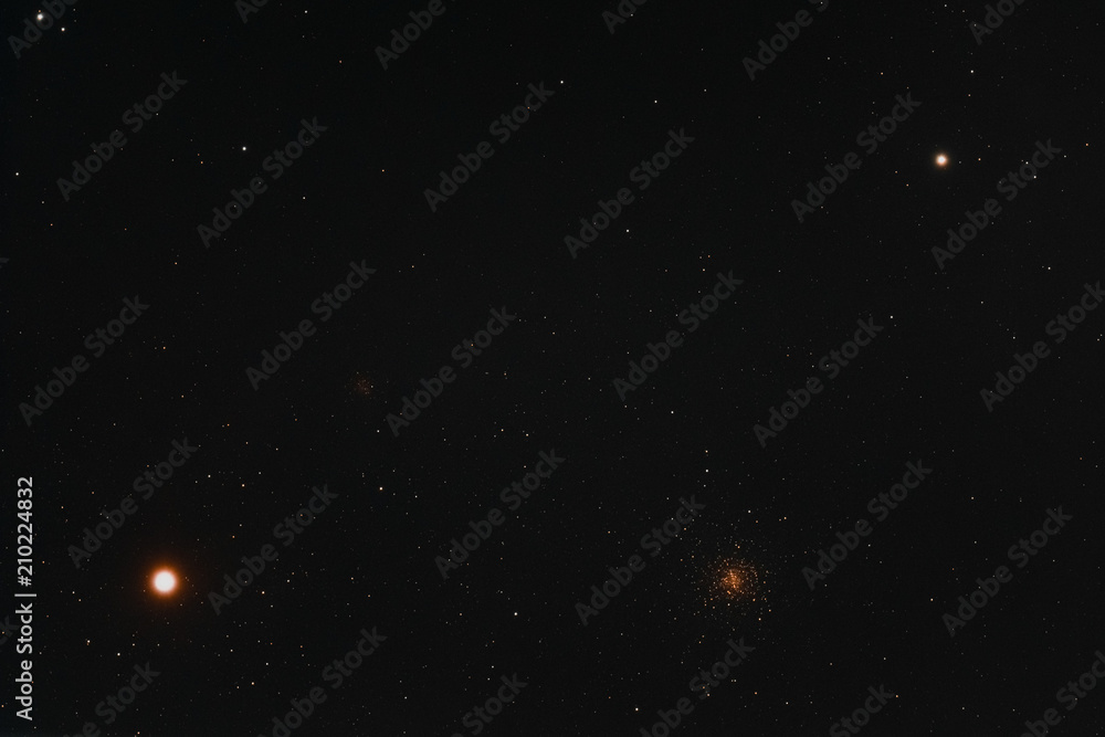 Obraz premium The two bright stars Antares and Alniyat, and the two globular clusters Messier 4 and NGC 6144 in constellation of Scorpius as seen from Mannheim in Germany.