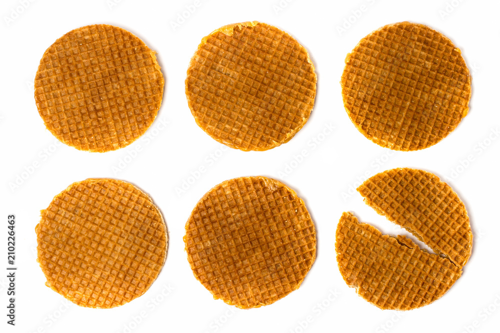 Set of Dutch cookies and one broken on a white, isolated. The view from the top. Set of Dutch cookies and one broken on a white, isolated. The view from the top.