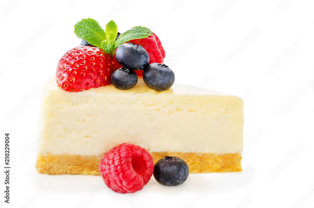 Cheesecake with fresh berries and mint leaves isolated Cheesecake with fresh berries and mint leaves isolated