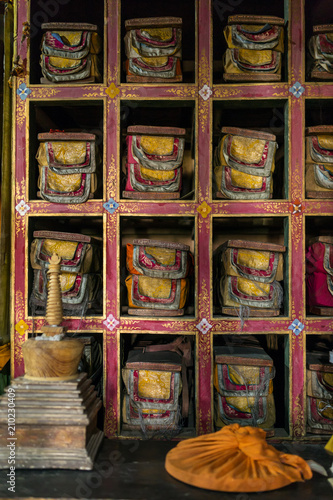 Folios of old manuscripts in library of Stakna gompa Tibetan Buddhist Monastery in Ladakh, India photo