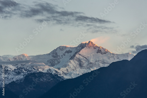 Kangchenjunga mountain at sunrise view from Pelling in Sikkim, India. Kangchenjunga is the third highest mountain in the world. photo