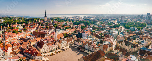 Amazing aerial view of the Tallinn old town with many old houses sea and castle on the horizon.