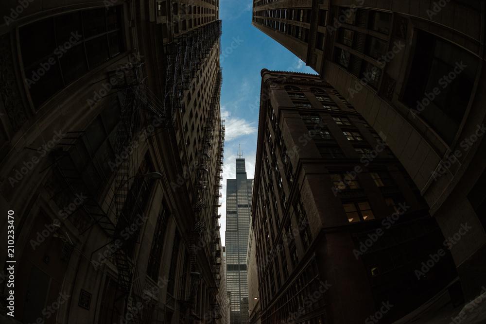 Iconic Chicago Skyscraper Standing Above The Alley Below