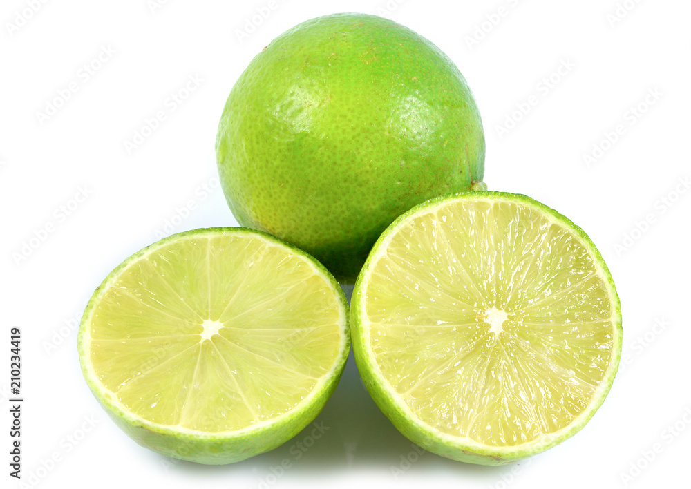 Juicy slice of lime, citrus fruit with green lemon half isolated on white background, Tropical fruit, Flat lay, top view. Juicy slice of lime, citrus fruit with green lemon half isolated on white background, Tropical fruit, Flat lay, top view.