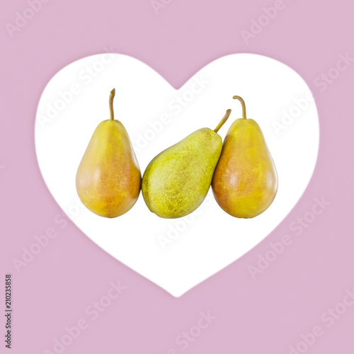 Three pears on a background of a pink heart