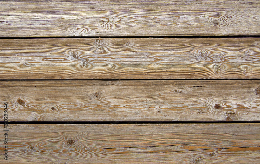 Obraz premium The texture of the boards. Wooden wall of the house. A fence made of boards. Wooden floor