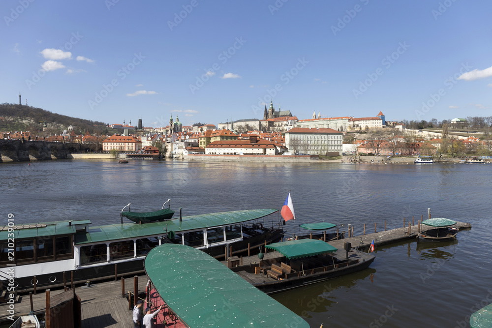 Fototapeta premium Spring Prague gothic Castle with the Lesser Town above River Vltava in the sunny Day, Czech Republic