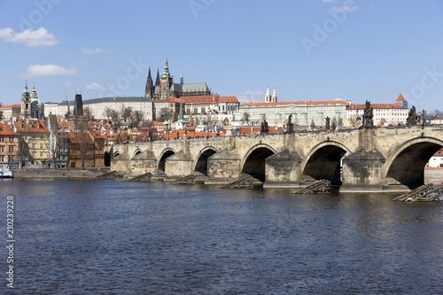 Spring Prague gothic Castle and Charles Bridge with the Lesser Town in the sunny Day, Czech Republic