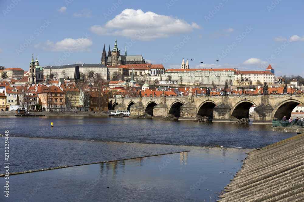 Spring Prague gothic Castle and Charles Bridge with the Lesser Town in the sunny Day, Czech Republic