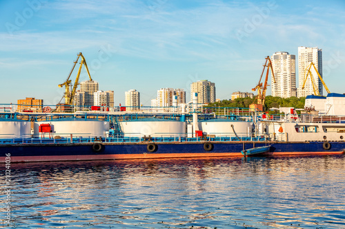 barges and cranes in the river port photo