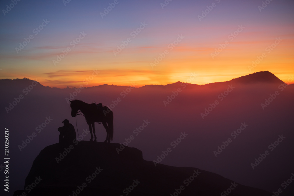 Unidentified local people or Bromo Horseman at the mountainside of Mount Bromo, Semeru, Tengger National Park, East Java of Indonesia.
