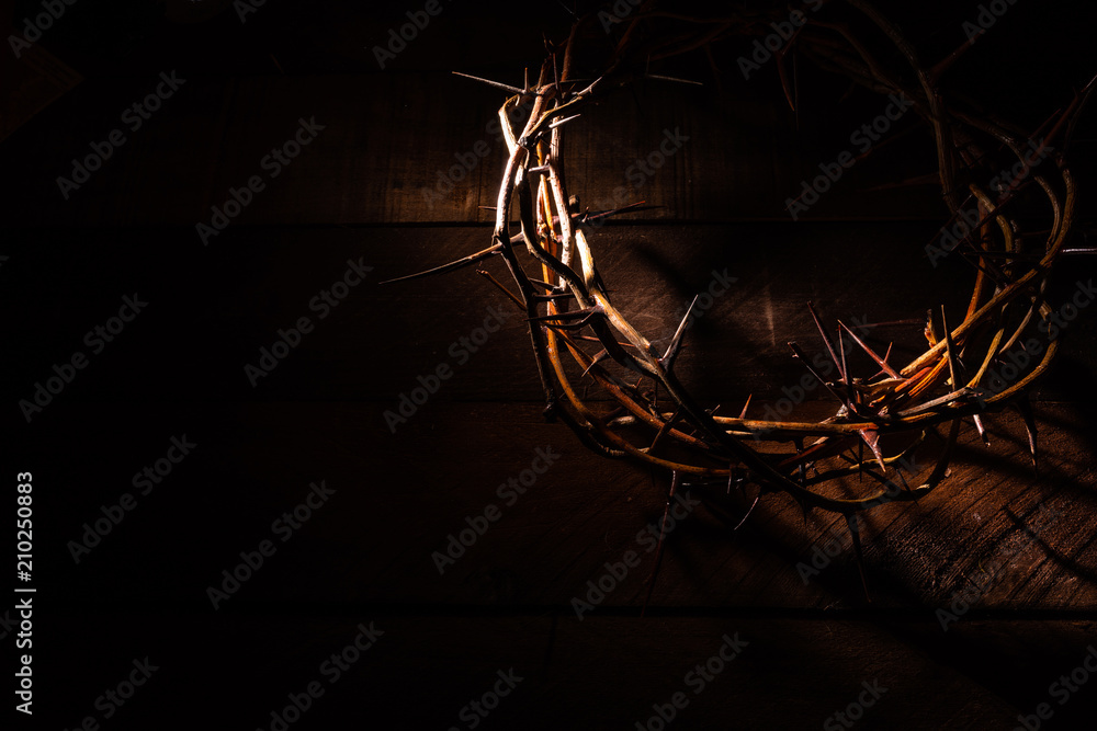 Fototapeta premium An authentic crown of thorns on a wooden background. Easter Theme